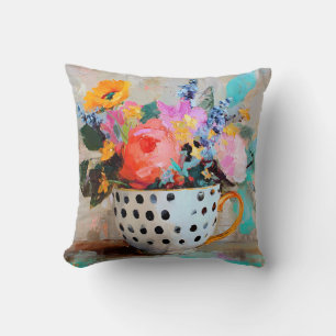 Coussin Fleurs colorées dans une tasse à thé à pois