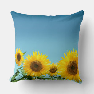 Coussin Fleurs de soleil élégantes sur les tons bleu ciel