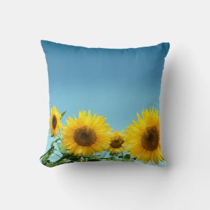 Coussin Fleurs de soleil élégantes sur les tons bleu ciel