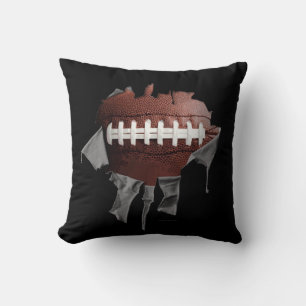 Coussin foncé déchiré du football