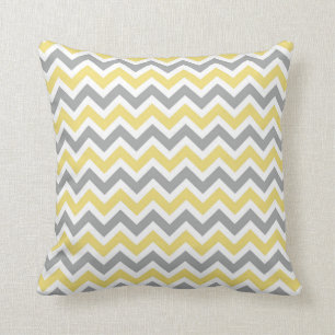 Coussin gris et jaune de motif de Chevron