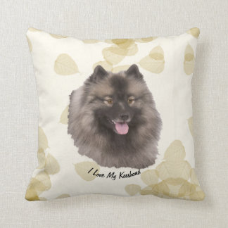 Coussin Keeshond sur le feuille bronzage