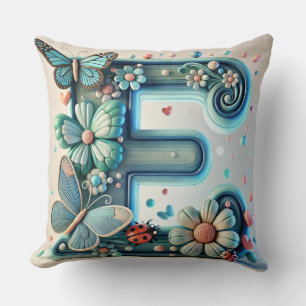 Coussin Lettre E florale élégante avec papillons