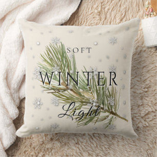 Coussin Lumière d'hiver douce avec branche de pin et neige