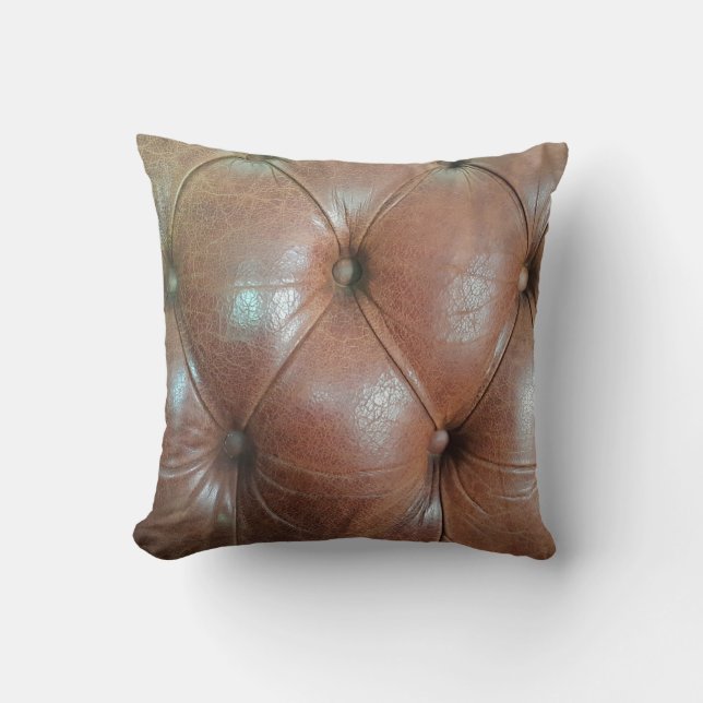 Coussin Lumière sur la surface du canapé en cuir marron, t (Recto)