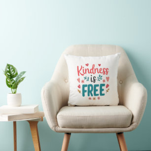 Coussin Message positif "Soyez gentil" avec des cœurs