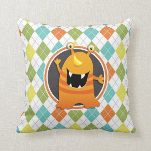 Coussin Monstre orange sur Motif Jacquard coloré