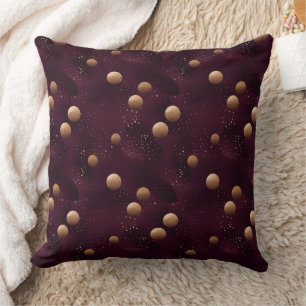 Coussin motif bordeaux à pois dorés