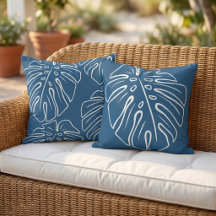 Motif de feuille tropicale blanche sur fond bleu c