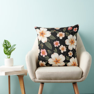 Coussin Motif floral lumineux sur fond noir