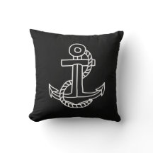 Coussin nautique noir et ancre blanche.