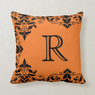 Coussin orange et noir de damassé de monogramme