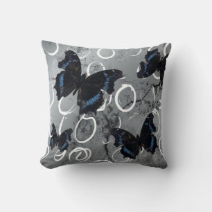 Coussin Papillons noirs et bleus sur fond argenté avec cer