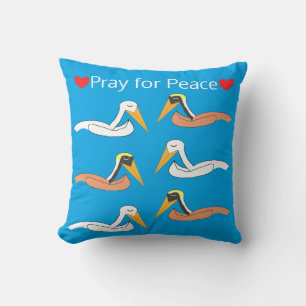 Coussin Pélicans priant pour la paix
