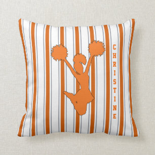 Coussin rayé orange de pom-pom girl