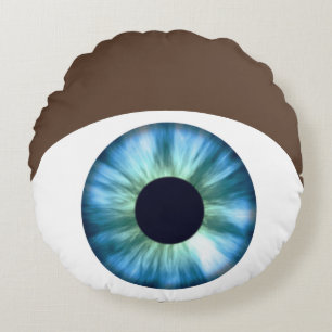Coussin rond de la peau foncée de l'oeil bleu