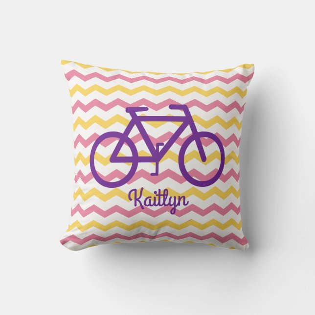 Coussin rose et jaune Chevron avec Vélo violet (Recto)