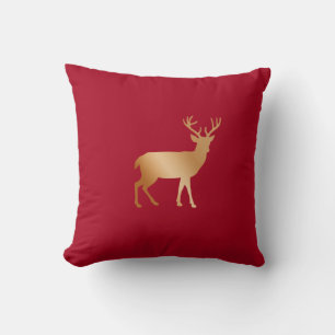Coussin Silhouette de renne doré sur fond rouge bordeaux