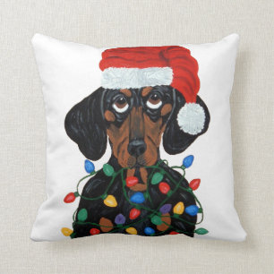 Coussin Teckel Père Noël embrouillé dans des lumières de