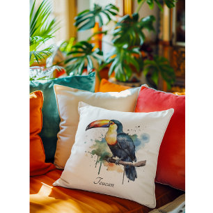 Coussin toucan coloré assis sur une branche