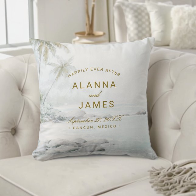Coussin Tropical Watercolor Beach Wedding Keepsake Pillow  (Personalized beach wedding pillow with “Alanna and James” text on a cream tufted couch.)