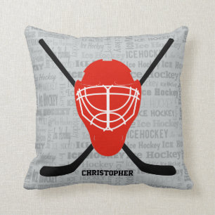 Coussin Typographie rouge de casque et de bâtons de hocke