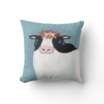 Vache laitière et couronne de fleurs rouges