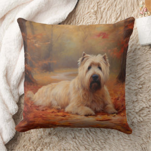 Coussin Wheaten Terrier dans les feuilles d'automne automn