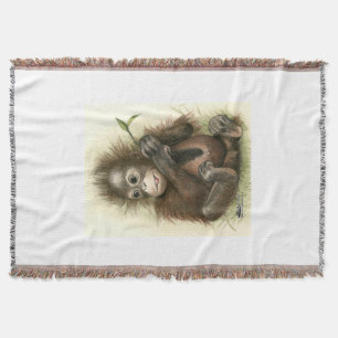 Couverture Bébé orang-outan avec des feuilles