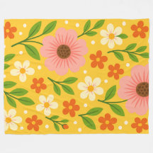 Fleurs roses, crème et orange avec des feuilles ve