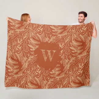 Couverture Polaire Monogramme vert parmi les feuilles