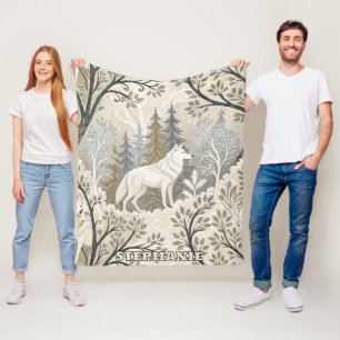 Couverture Polaire Une forêt d'hiver paisible avec des loups blancs