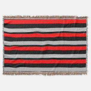 Couverture rayée noire et argentée rouge de jet