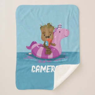 Couverture Sherpa Baignade en Groot sur un flotteur de piscine