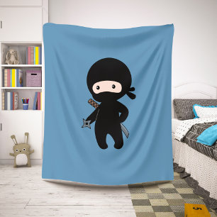 Couverture Sherpa Tiny Ninja tenant l'étoile au volant sur le bleu