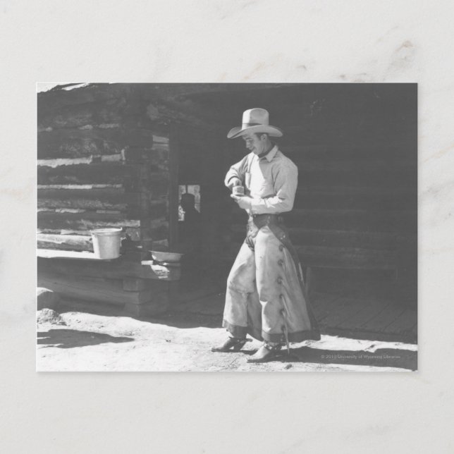 Cowboy eating from a Peter Pan peanutbutter can. Postcard (Front)