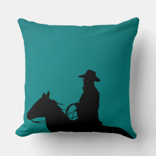 Cowboy & horse silhouette on teal-green background throw pillow