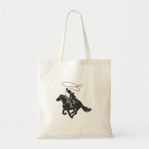 Cowboy on bucking horse running with lasso tote bag