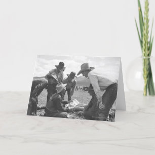 Cowboys looking a magazine card