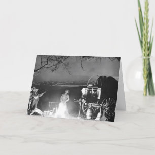 Cowboys playing and singing around a campfire card