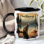 Coyote at Sunrise Lake Reflection Mug<br><div class="desc">Start your day with the wild beauty of the Coyote at Sunrise Lake Reflection Mug. This stunning mug features a majestic coyote standing by a serene lake at sunrise, with the tranquil forest and golden sky beautifully reflected in the water. Customized with your name, it adds a personal touch that...</div>