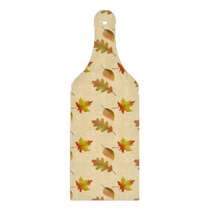 Cozy autumn maple leaves oak leaves cutting board
