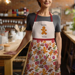 Cozy Christmas Gingerbread Man Grammie's Kitchen Apron<br><div class="desc">This festive design was created using my sweet Scandinavian inspired cookies shaped like a gingerbread man, a Christmas tree, and a star surrounded by citrus, dried spices, greenery, and berries that evoke the feel of a warm cottage kitchen at grandma's filled with the scents of holiday baking! The bottom is...</div>