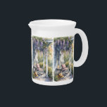 Cozy Porch with Wisteria and Butterflies Pitcher<br><div class="desc">This tranquil watercolor design captures the essence of a slow, sunlit afternoon on a country porch. Cascading wisteria blooms in soft purples drape over a weathered pergola, framing a peaceful scene centred around a cozy rocking chair topped with a quilted cushion. A wide-brim straw hat rests nearby, suggesting recent company,...</div>