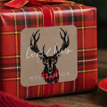 Cozy & Warm | Red Buffalo Plaid Reindeer Family Square Sticker<br><div class="desc">Cozy & Warm Vintage Wilderness Reindeer Christmas featuring our rustic vintage style hand-drawn black etched ink wilderness reindeer wearing glasses, with a cozy red buffalo plaid winter scarf wrapped around the reindeer's neck. Faux natural brown cardboard textured background adds a natural style. The design incorporates a modern flair and paired...</div>