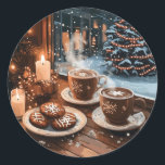 Cozy Winter Cafe with Hot Cocoa and Cookies Classic Round Sticker<br><div class="desc">Experience the warmth of the holidays with a cozy winter illustration featuring steaming hot cocoa in snowflake mugs,  festive cookies,  and glowing candles on a wooden table by the window. Outside,  snow falls gently,  framing a beautifully lit Christmas tree and a charming snowy street.</div>