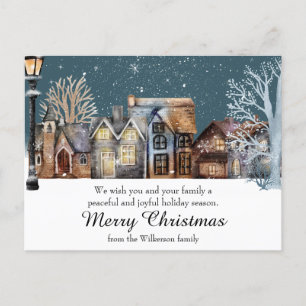 Cozy Winter Village at Night with Falling Snow Postcard
