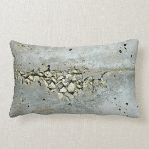 Cracked concrete wall with small stones lumbar pillow