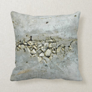 Cracked concrete wall with small stones throw pillow