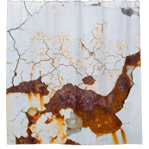 Cracked white paint, rusty car.